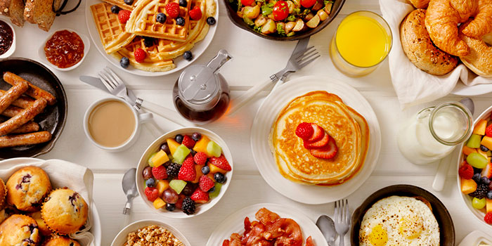 breakfast foods arranged on a table
